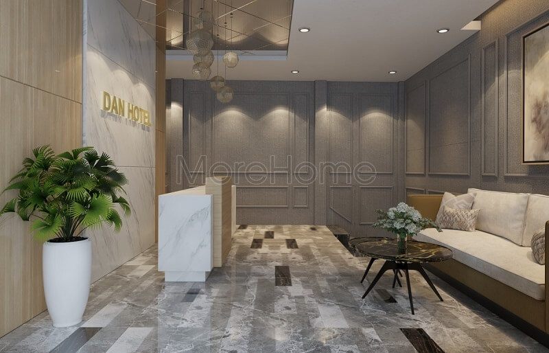 Mẫu thiết kế sảnh khách sạn hiện đại với bức tường đá màu trắng tinh tế kết hợp bộ sofa vải cao cấp tạo nên không gian tinh tế, cuốn hút.